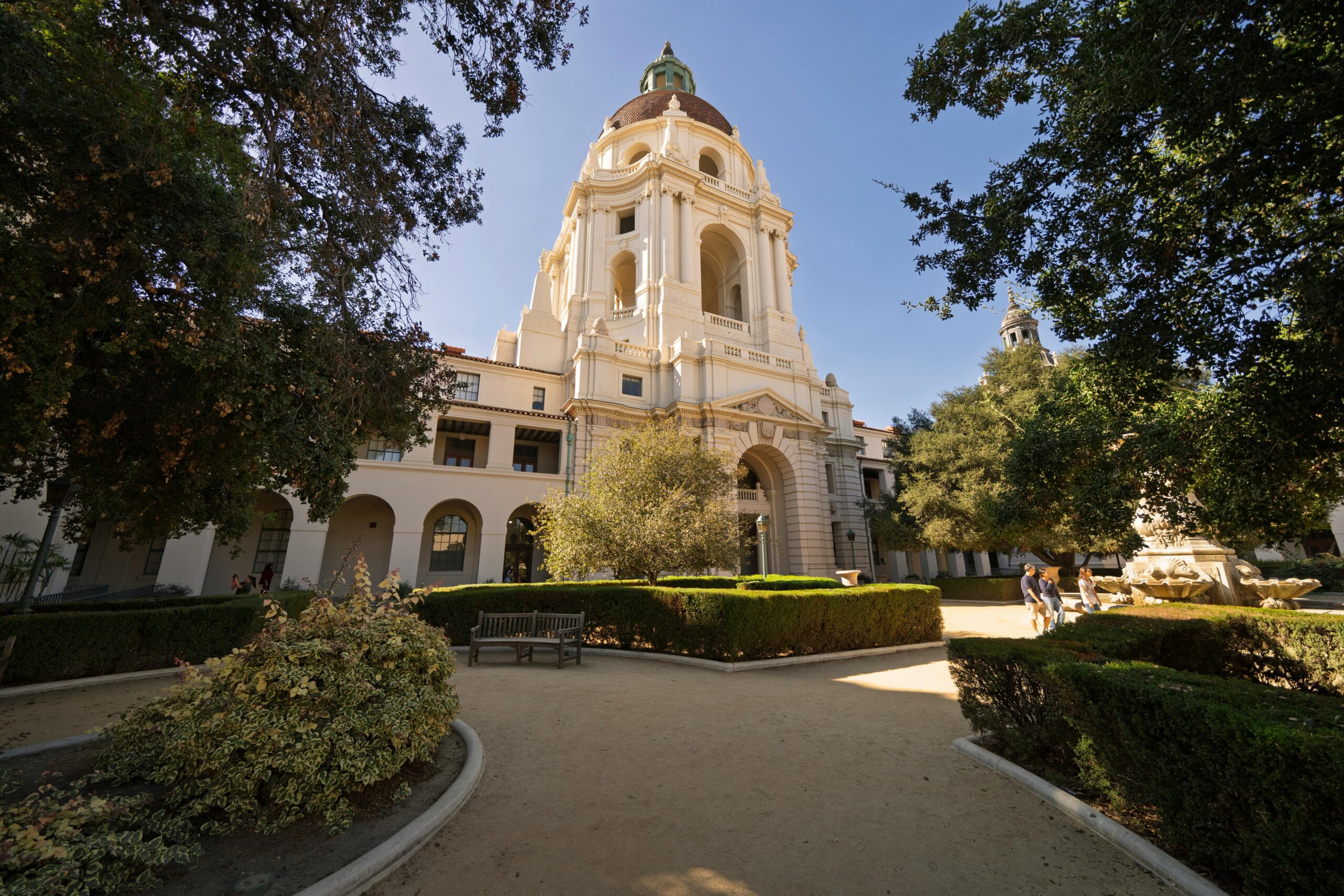 Pasadena City Hall, a historic building with a large dome surrounded by trees and landscaped grounds on a sunny day.