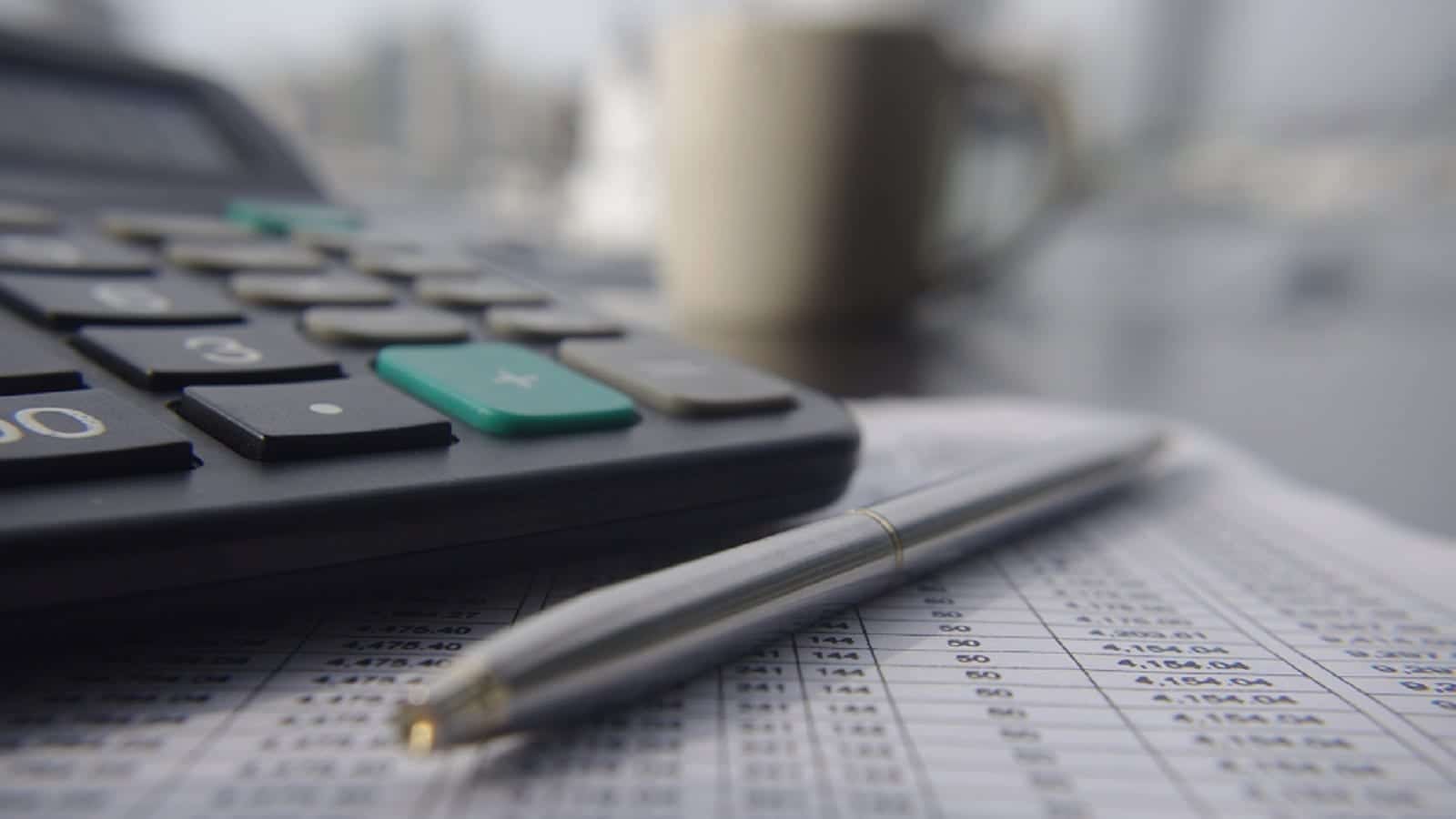 Calculator With A Pen Stock Photo