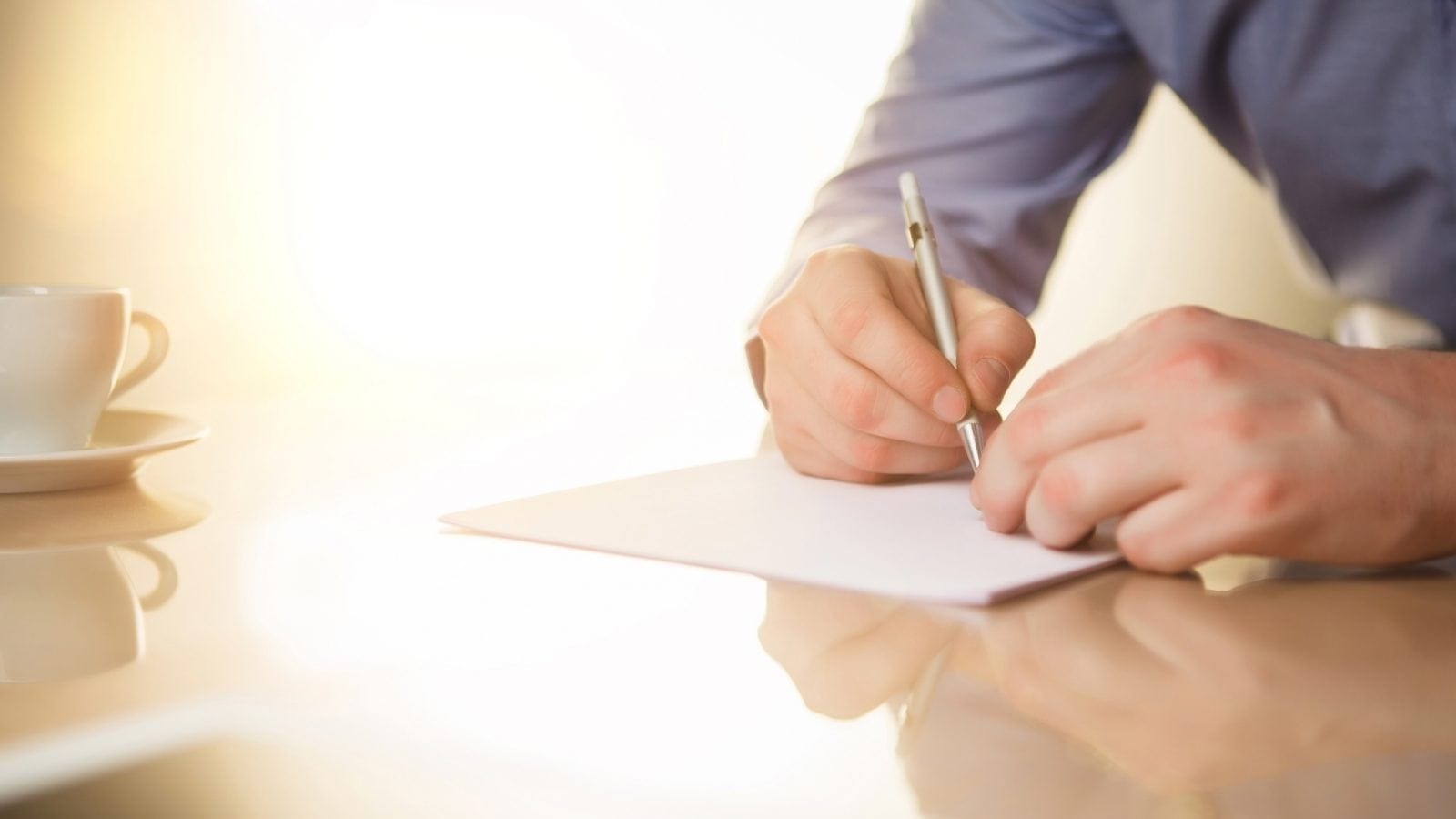 Male Signing Document Stock Photo