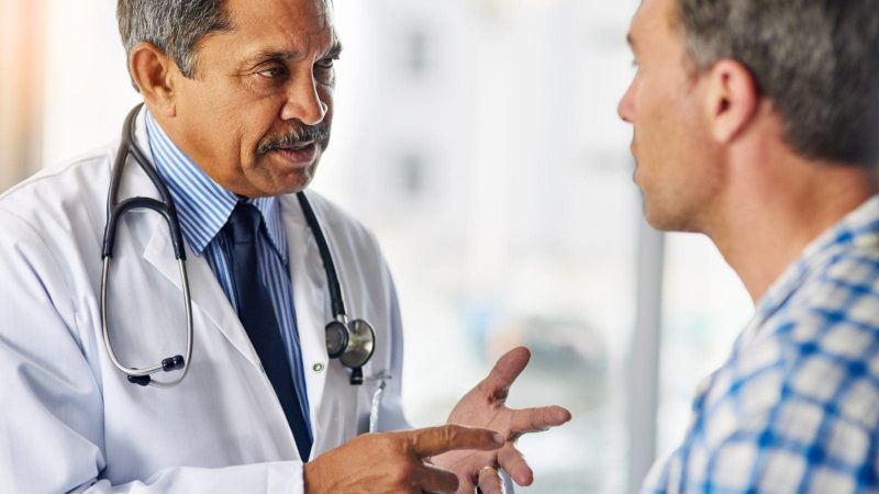 Doctor Giving Advice Stock Photo