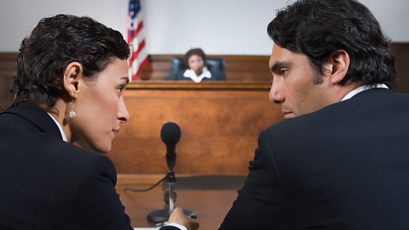 A lawyer and defendant talking