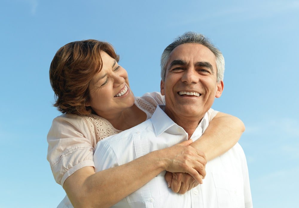 Elderly couple embracing each other
