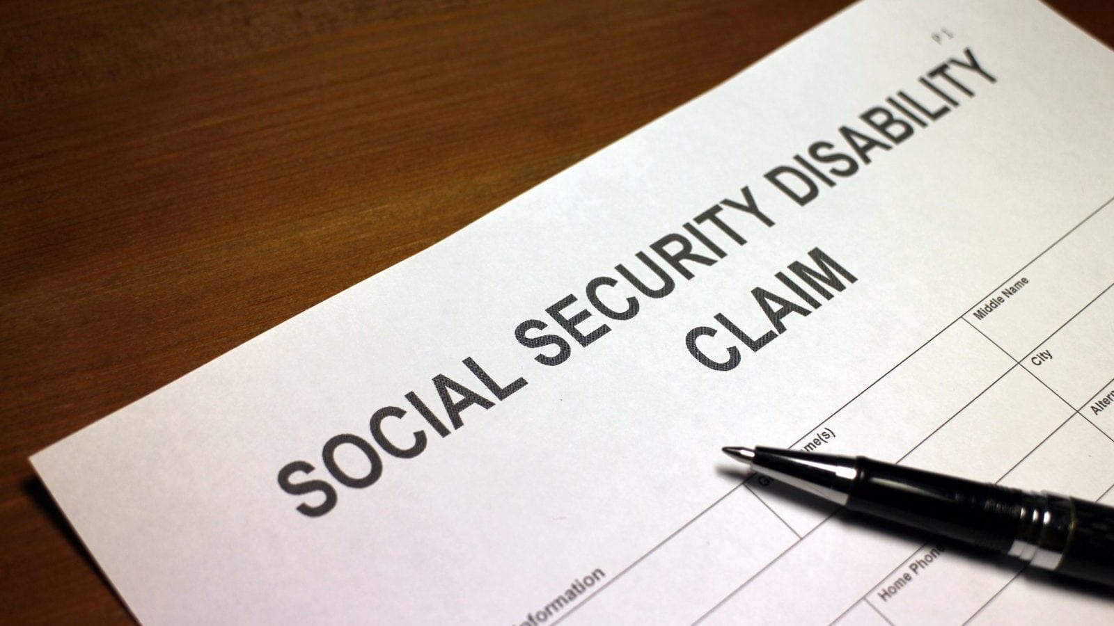 Someone filling out Social Security Disability Claimity Disability