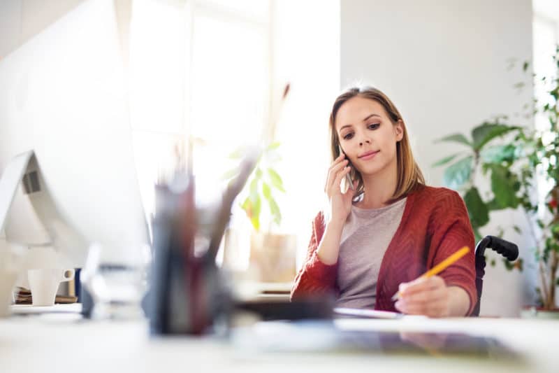 woman calling a social security disability lawyer